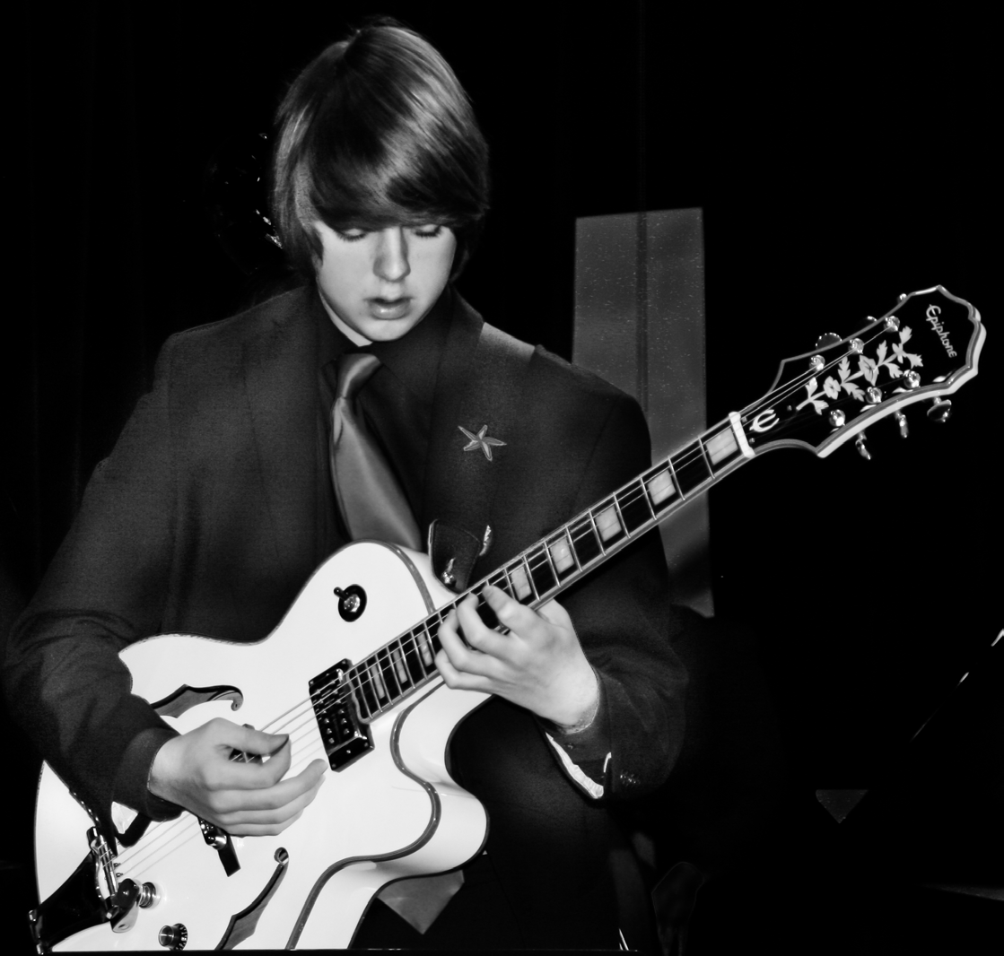 Niko Winchell Performing a Solo on Guitar